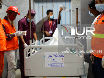 Hospital staffs seen waiting for the lift while taking a dead body to the morgue from the post-operative ward in Dhaka, Bangladesh, on Septe...