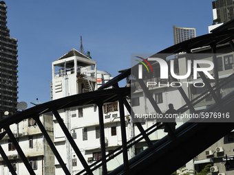 The silhouette of people ride escalators at BTS Skytrain in Bangkok, Thailand, on September 06, 2020. (