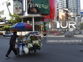 A Thai street food vendor pushes cart loaded in Bangkok, Thailand, on September 06, 2020. (
