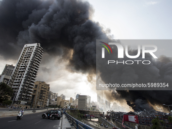  Firefighters try to douse flames billowing from a huge fire that broke out at a warehouse at the Beirut's sea port, Lebanon, on September 1...