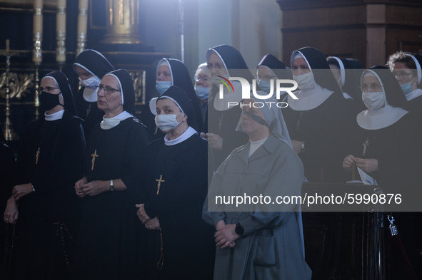 A group of nuns seen praying ahead of  Cardinal Marian Jaworski's funeral mass inside the Bernardine monastery in Kalwaria Zebrzydowska.
On...