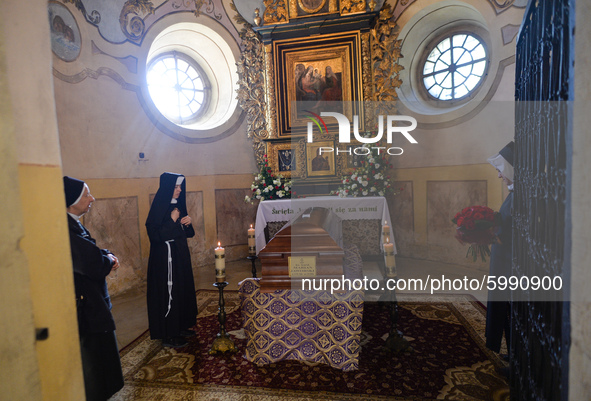 Nuns seen praying next to Cardinal Marian Jaworski's coffin ahead of the funeral mass inside the Bernardine monastery in Kalwaria Zebrzydows...