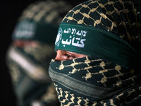 Military spokesman for al-Qassam Brigades followed by Hamas, which controls the Gaza Strip during a press conference in front of the media,...