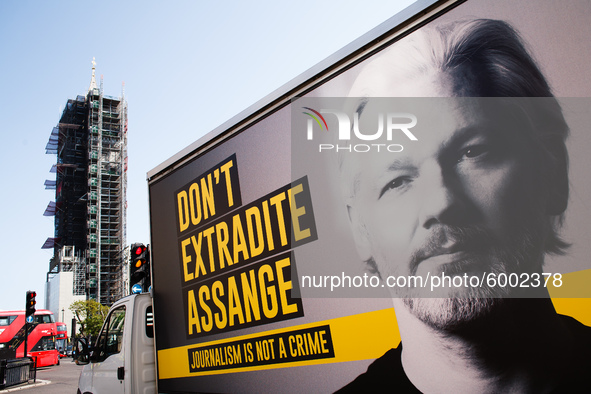 A billboard van calling for an end to extradition proceedings against WikiLeaks founder Julian Assange waits at traffic lights in Parliament...