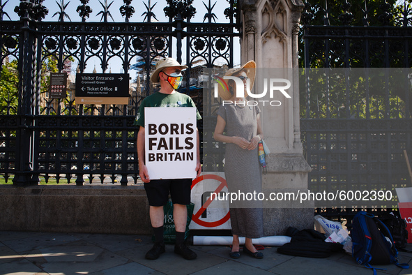 Anti-Brexit activists demonstrate outside the Houses of Parliament in Parliament Square in London, England, on September 14, 2020. 