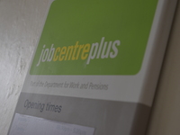 A sign for a Jobcentre Plus, in Manchester, providing the unemployed with a economic and soical safety nets, through different benefits, and...