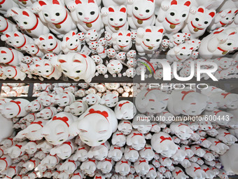 The Maneki Neko are pictured at GotokujiTemple in tokyo May 22, 2015. Thought to bring luck and prosperity to their owners, these cats are f...