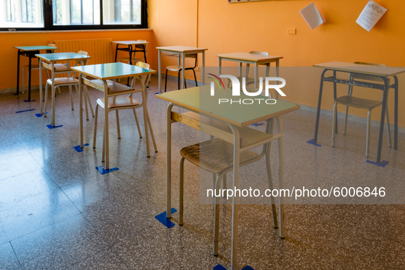 Detail of the desks of a school classroom with spacing and horizontal signs in the Don Tonino Bello High School in Molfetta on 16th Septembe...