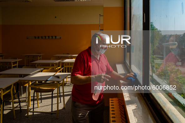 A janitor cleaning and disinfecting desks and the classroom in the Don Tonino Bello High School in Molfetta on 16th September 2020.
The reo...