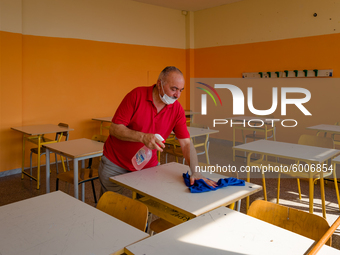 A janitor cleaning and disinfecting desks and the classroom in the Don Tonino Bello High School in Molfetta on 16th September 2020.
The reo...