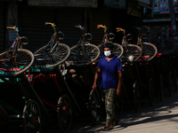 A man wearing face mask as he walks on the street in Dhaka, Bangladesh on September 19, 2020. (