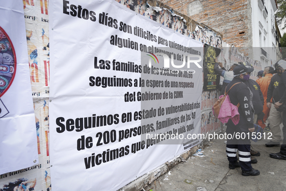 Members of a rescue group placed a sign outside where the Alvaro Obregon 286 building was located on September 19, 2020, in Mexico City, Mex...
