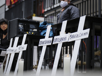 Crosses in memory of victims are seen outside of Tlalpan multi-family on September 19, 2020, in Mexico City, Mexico.
Rescuers, relatives of...