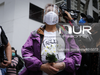 Relatives of victims attend the religious ceremony outside of Tlalpan multi-family on September 19, 2020, in Mexico City, Mexico.
Rescuers,...