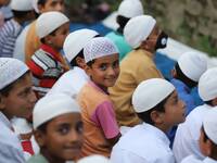 Muslim boys wearing skull caps take part in Annual Conference amid COVID-19 (coronavirus) Pandemic Held at Jamia Islamia Quran in Sopore, Di...