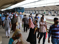 Travelers arrived at Kamolapur railway station as Bangladesh railway resumed all passenger train services following its closure due to the C...