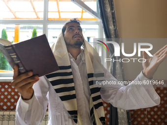 An Orthodox Jew praying on the last day of Rosh Hashanah, the Jewish New Year, in the synagogue at the Center for the History and Culture of...