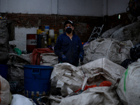 A woman carries out the process of separating materials in a recycling warehouse in the Las Cruces neighborhood in Bogota, Colombia on Septe...