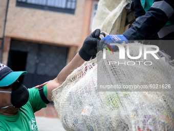 A worker loads the recycled material into the truck during a working day in the town of San Cristóbal, in Bogota, Colombia on September 9, 2...