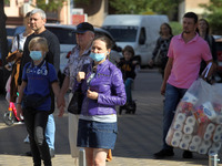 People wearing protective face masks amid the COVID-19 coronavirus epidemic are seen in Kyiv, Ukraine on 22 September 2020. 
 (