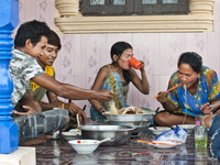 Portrait of a Khmer family during lunch in Battambang, Cambodia, in April 2016. (