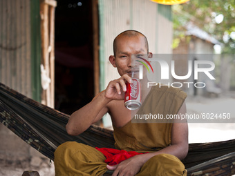 Portrait of a Buddhist Monk during prayer in Phnom Penh, Cambodia, in April 2016. (