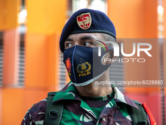 Portrait of a Millitary personnel while guarding street sudirman during partial lock down on 24 September 2020. Jakarta's return to stricter...