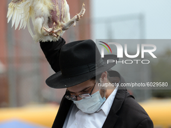 A religious Jews in Crown Heights, Brooklyn, US, on September 24, 2020 perform kaparot ritual. Many Orthodox Jews perform the age-old tradit...