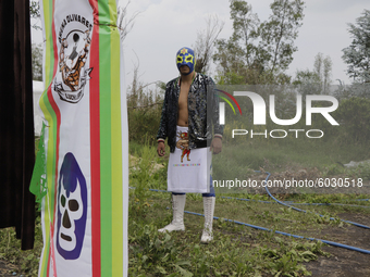 Gran Felipe Jr., a member of Chinampaluchas, prior to the wrestling function in chinampa of Lake Xochimilco during the health emergency due...