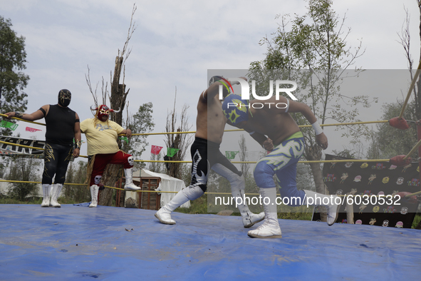 Members of Chinampaluchas, during a wrestling function in the chinampa of Lake Xochimilco during the health emergency due to COVID-19 in Mex...