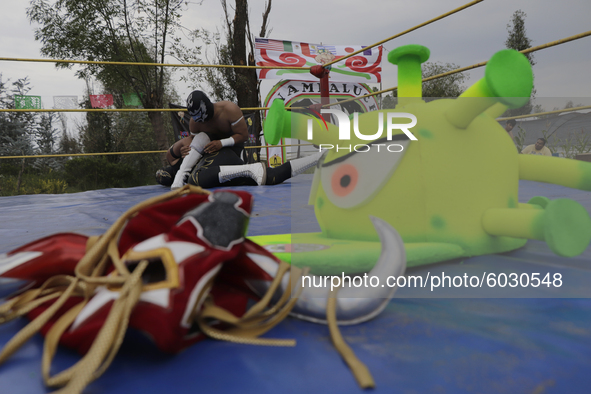 Mr. Jerry mask and coronavirus hat, belonging to members of Chinampaluchas, during wrestling function in Chinampa of Lake Xochimilco during...