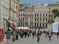 Crowded Krakow's Main Market Square with people walking without protective masks.
The number of COVID-19 infected in Poland is constantly gr...