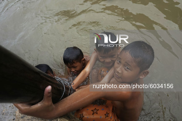 Children in Sungsang, Banyuasin Regency, South Sumatra are enjoying swimming in the sea in front of their house in Sungsang District, Banyua...