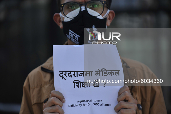 A Nepalese youth holds placard during a demonstration expressing Solidarity to support Prof. Dr. Govinda KC on Saturday, September 26, 2020...