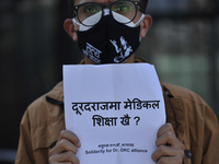 A Nepalese youth holds placard during a demonstration expressing Solidarity to support Prof. Dr. Govinda KC on Saturday, September 26, 2020...