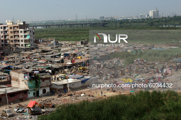 A view of demolished slum dwellings after demolition drive by the Delhi Development Authority (DDA) against encroachments at Jamia Nagar's D...