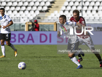 Alejandro Papu Gomez of Atalanta BC and Mergim Vojvoda of Torino FC compete for the ball during the Serie A football match between Torino FC...