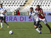 Alejandro Papu Gomez of Atalanta BC and Mergim Vojvoda of Torino FC compete for the ball during the Serie A football match between Torino FC...