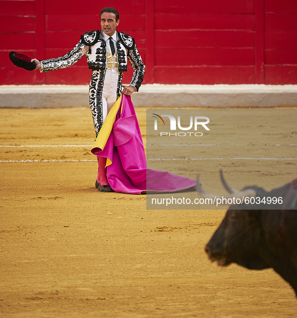 Spanish bullfighter Enrique Ponce looks on the bull during the Virgen de las Angustias Bullfighting Festival at the Monumental de Frascuelo...