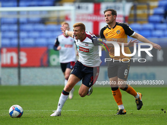   Boltons Eoin Doyle clashes with Matty Dolan during the Sky Bet League 2 match between Bolton Wanderers and Newport County at the Reebok St...