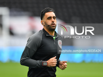  
Assistant referee, Bhupinder Gill warms up ahead of kick-off during the Sky Bet Championship match between Derby County and Blackburn Rov...