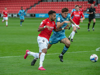  
Liam Kitching of Forest Green Rovers tackles Bruno Andrade of Salford City FC during the Sky Bet League 2 match between Salford City and F...