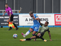   Barrow's Bradley Barry in action with Colchester United's Paris Cowan-Hall  during the Sky Bet League 2 match between Barrow and Colcheste...