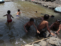 Indonesian children playing at the Ciliwung river in Bogor, West Java, 27 September 2020. World Rivers Day (WORD) is celebrated yearly on th...