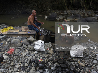 A man is seen cleaning at the Ciliwung river in Bogor, West Java, 27 September 2020. World Rivers Day (WORD) is celebrated yearly on the fou...
