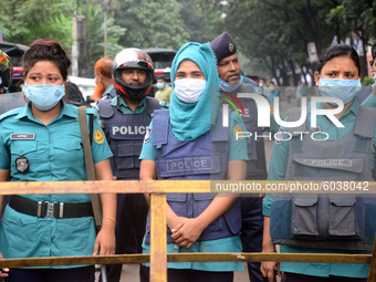 Police standard in front of Jute Ministry during Left Democratic Alliance demonstration demanding reopen all government jute mills in Dhaka,...