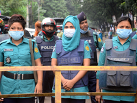 Police standard in front of Jute Ministry during Left Democratic Alliance demonstration demanding reopen all government jute mills in Dhaka,...