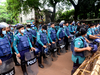 Police standard in front of Ministry of Education during Student Union activists stage a demonstration demanding reducing the fee of school...
