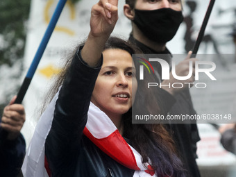 A woman shows a victory sign during a rally of solidarity with Belarusian protests in Kyiv, Ukraine on 27 September 2020. Belarusians who li...
