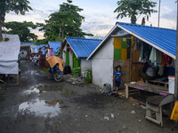 A child victim of a disaster is in front of the temporary shelter he occupies in Palu, Central Sulawesi Province, Indonesia on September 27,...